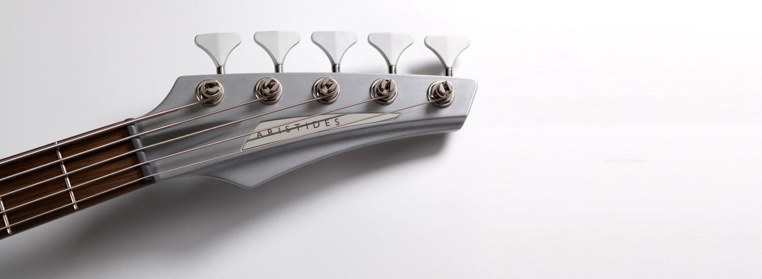 aristides bass 050 neck detail silver with chrome brand inlay